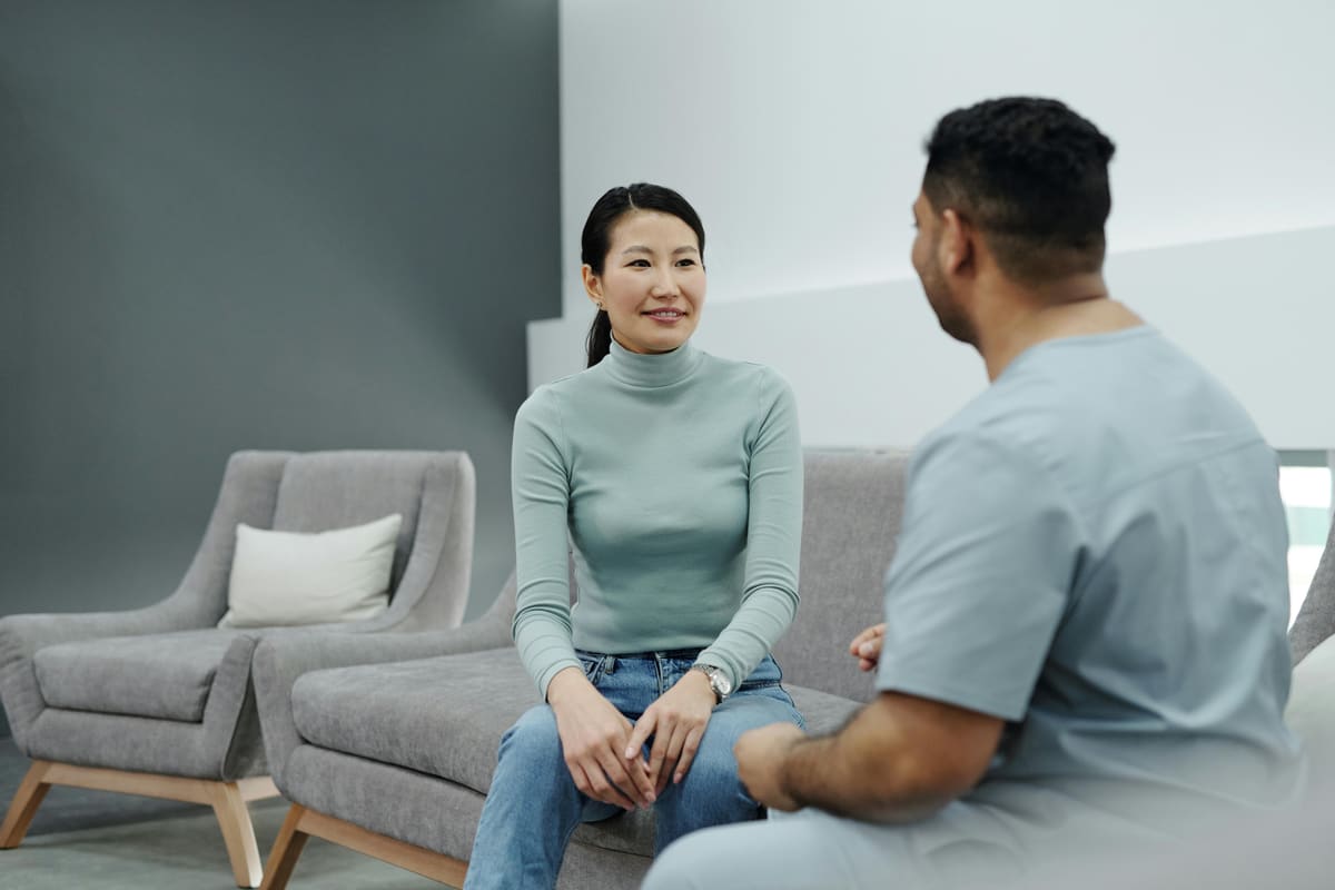 Counselor speaking with a patient during a treatment session